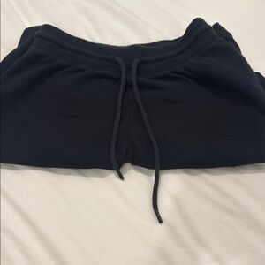 Black Aritzia wide leg ribbed pants.